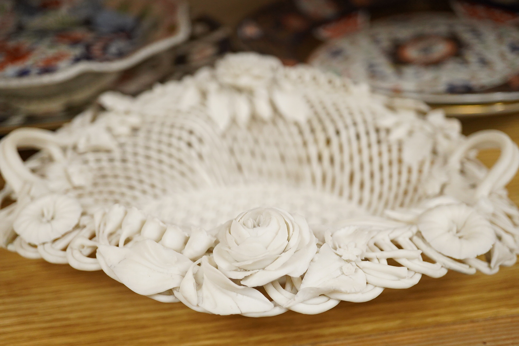 A Belleek porcelain basket, two Masons Ironstone dishes, a pair of Royal Crown Derby Japan pattern dishes and an ironstone leaf shaped dish (6).